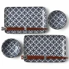 Blue and white shippou pattern on a ceramic sushi for two set made in Japan available at Miya.